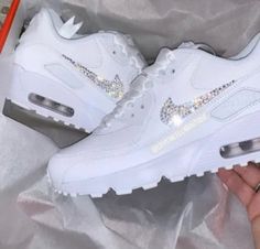 Your Custom Unique White Sparkly Crystal Nike Air Max 90 shoes are fully custom hand crystallised and guaranteed to bring some sparkly BLING to your life! These Nike Air Max 90 Trainers are 100% unique with no two pairs the same. Super comfortable shoes! 𝕀𝕄ℙℝ𝔼𝕊𝕊 𝔼𝕍𝔼ℝ𝕐𝕆ℕ𝔼 with these custom Crystalized Air Max Kicks today! Size: Please contact us if unsure on what size you need.  UK 2 / EU 34 / Girls 2.5Y UK 2.5 / EU 35 / Girls 3Y UK 3 / EU 35.5 / Girls 3.5Y UK 3.5 / EU 36 / Girls 4Y / Womens Air Max 90, Sick Shoes, 90 Shoes, Swarovski Nike, Nike Air Max 90s, Nike Shoes Women Fashion, Bedazzled Shoes, Bling Converse, Air Max 90s