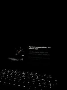 a computer keyboard sitting on top of a black surface with the words'mr manna always told me, put your head first '