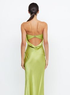 the back of a woman wearing a lime green dress