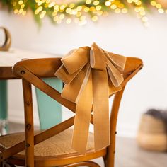 a wooden chair with a bow on it