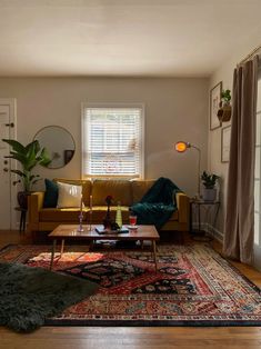 a living room filled with furniture and a rug