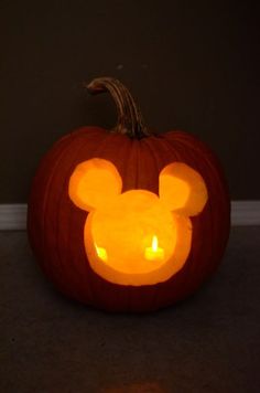 a mickey mouse pumpkin carved into the shape of a jack - o'- lantern