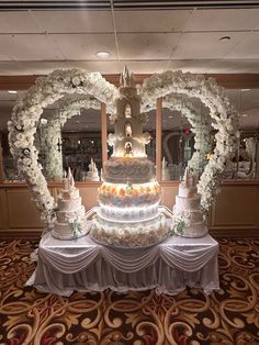 a large wedding cake sitting on top of a table