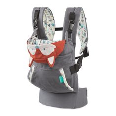 a baby carrier with an orange fox on it's back and grey fabric lining