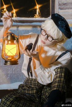 a woman with glasses holding a lantern and looking at it's light in front of her