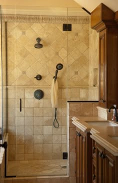 a walk in shower sitting inside of a bathroom