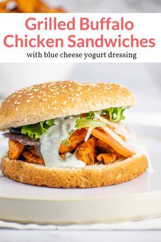 grilled buffalo chicken sandwiches with blue cheese yogurt dressing on a white plate