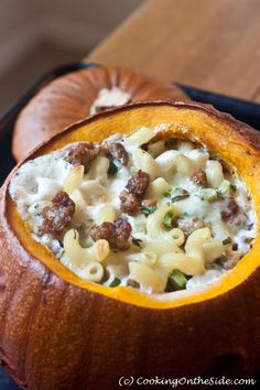 a pumpkin filled with macaroni and cheese