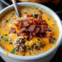 a close up of a bowl of soup with bacon