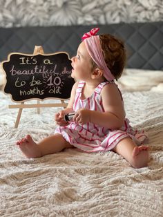 Baby girl with pink outfit sitting on bed with a board says “it’s a beautiful day to be 10 months old” 9 Months Old Baby Photoshoot, Baby Photoshoot Ideas 10 Months, 10 Month Old Milestones Photo Ideas, 10month Baby Photoshoot, 10 Month Baby Photoshoot Photo Ideas, 10 Month Milestones Baby, 10 Month Old Photoshoot, 10 Months Old Baby Photoshoot, 9 Months Baby Photoshoot Ideas