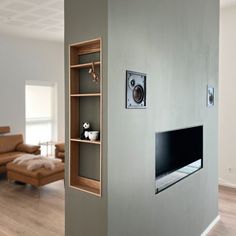 an entertainment center in the corner of a living room