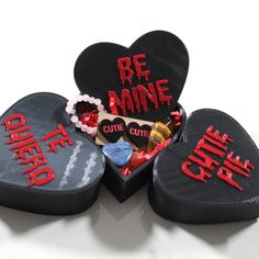 three heart shaped boxes with candy and candies in them that say be mine, cute little valentine's day