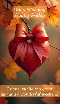 a red heart hanging from a tree with the words good morning happy friday