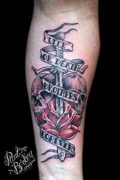 a tattoo on the leg of a person with a rose and two crosses in it