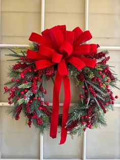 This gorgeous wreath is adorned with lush greenery, red berries and velvet ribbon. It's waiting to greet your friends and family for the holidays 🎄 Big Wreaths, Natural Wood Accents, Christmas Wreath Diy, Christmas Decor Trends, Outside Christmas Decorations, Christmas 2025, Winter Wreaths, Easy Christmas Decorations