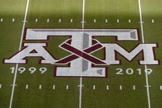 the texas a & m aggies logo is shown on an american football field