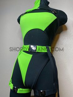 a mannequin is dressed in neon green and black