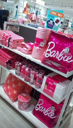 a display in a store filled with lots of pink items