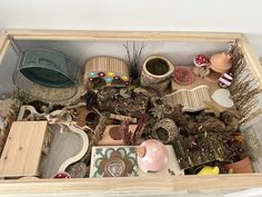 a wooden box filled with lots of different types of items