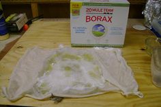 a box of borax sitting on top of a wooden table