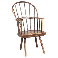 an old wooden chair sitting on top of a white background