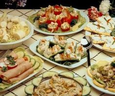 a table topped with lots of different types of food and words cooking for a crowd