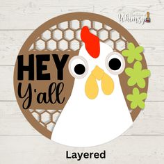 a chicken with the words hey y'all on it is in front of a wooden background