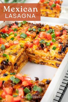 mexican lasagna casserole in a white baking dish with one slice cut out