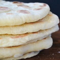 four flat breads stacked on top of each other with the words how to make perfect pita bread every time