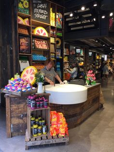 a person standing at a counter in a store