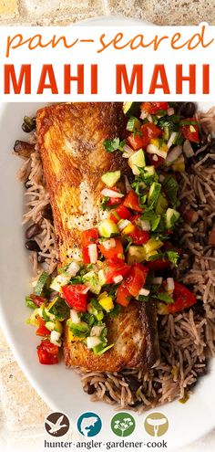 a plate with rice, meat and veggies on it that says pan - seared mahi mahi