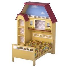 a doll house with a bed and bookcase in the shape of a child's bedroom