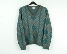 GREENWOODS Vtg Mens XL Knitted V-Neck Sweater Pullover Jumper Patterned Grey Top Size: XL Condition: Good used condition Colour: Grey, Green (Due to the quality differentiation between different monitors, the picture may not reflect the actual color of the item) Material: 100% Acrylic Weight: 470 g SKU: EV19 004 /eb/et/gr/as/rew2 Model in pictures usually wears size Large and is 185 cm (6,1 ft) tall  Measurements: Chest (armpit to armpit) 26" or 66 cm Sleeve (armpit to sleeve cuff) 19 1/4" or 49 Jumper Patterns, Sleeve Cuff, Sweater Pullover, Grey Green, Grey Top, Vintage 70s, Vneck Sweater, Warm Winter, Neck Sweater