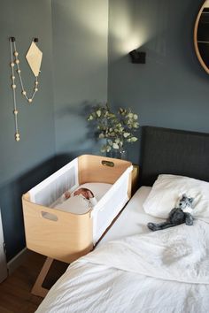 a baby's crib in the corner of a bedroom