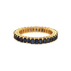 a gold ring with blue sapphire stones on the inside, and two rows of diamonds in the middle