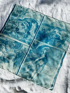 a blue and white cloth with pictures on it