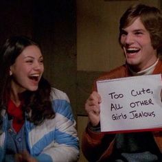 two people laughing and holding a sign that says too cute, all other girls's lemons