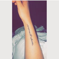 a woman's arm with a tattoo that reads, i love you to the moon and back