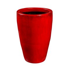 a red vase sitting on top of a white surface