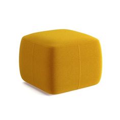 a yellow square ottoman sitting on top of a white floor