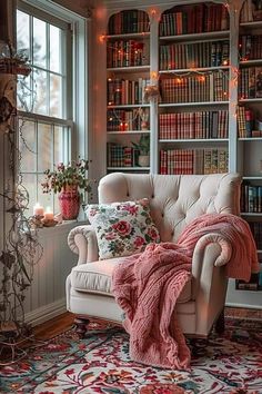 a living room filled with lots of furniture and bookshelves next to a window