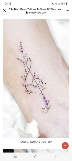 a small tattoo on the wrist with flowers