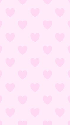 a pink wallpaper with hearts on it