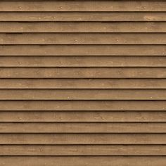 the side of a house with brown siding