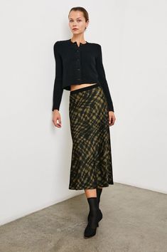 Look no further for the ultimate midi skirt. Call on the luxe satin crepe Berlin season-after-season for elevated comfort, with a high rise and exposed elastic waist. Cut on the bias for instantly flattering silhouette, the Berlin will be your new favorite skirt to dress up or down.55% Rayon | 45% Viscose.Imported. Recommend ordering true to size.Skirt Length: 38" (Measured from Small) Dry clean only. We are proud to introduce our Eco Collection, which features many of our classic products made Skirt To Dress, Denim Sweater Jacket, Satin Slip Skirt, Pre Fall Collection, Denim Sweater, Denim Accessories, Slip Skirt, Black Wedding Dresses, Leather Dresses