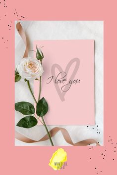 a pink card with a white rose on it