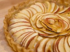 an apple pie with sliced apples on top