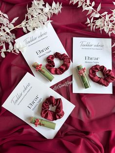 three different types of hair accessories on a red cloth