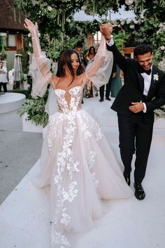 the bride and groom are walking down the aisle