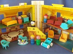 a doll house with furniture and toys in it